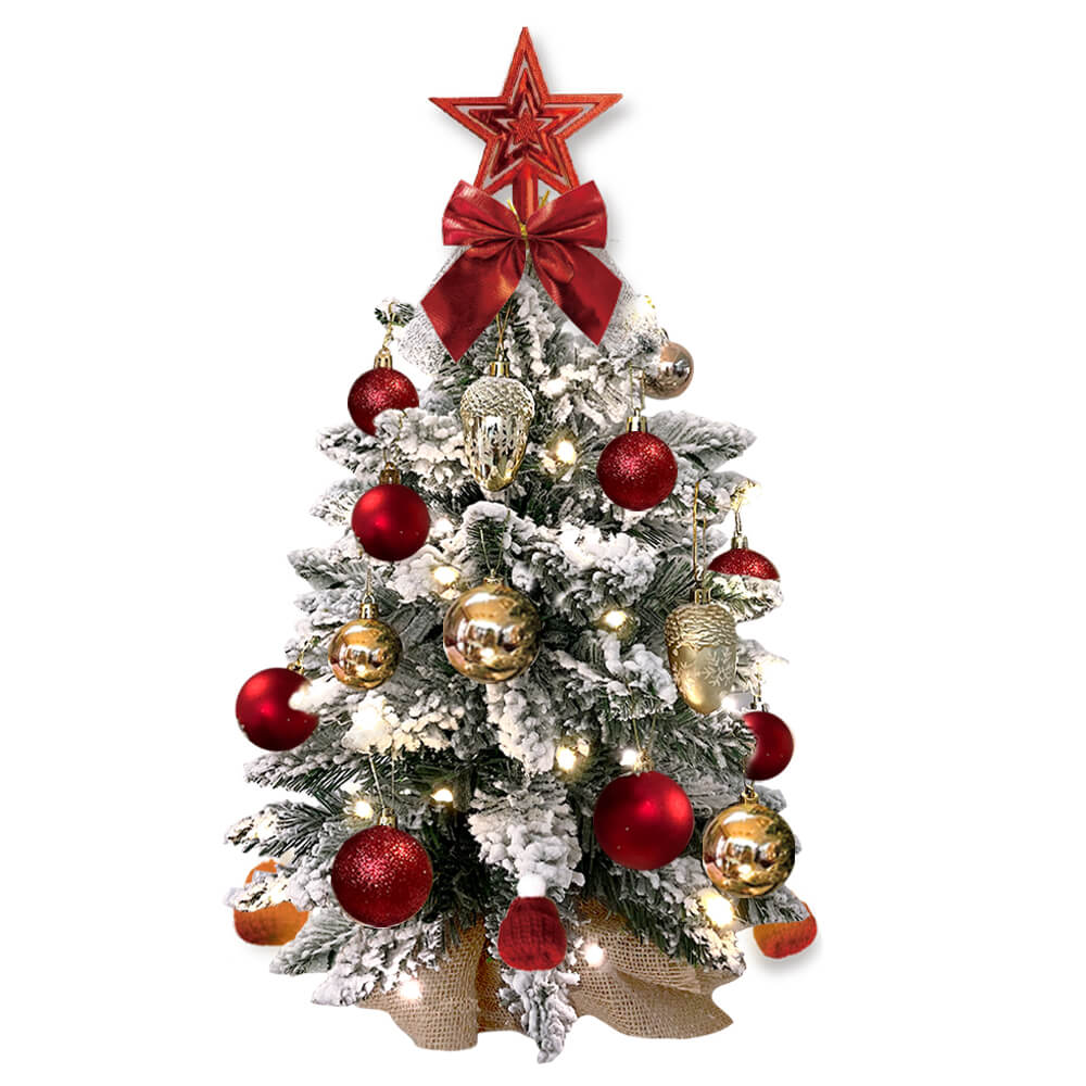 Decorated Christmas tree with red and gold ornaments on a white background