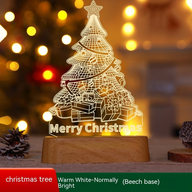 Decorative Christmas tree lamp with 'Merry Christmas' text on a wooden base, blurred lights in the background.