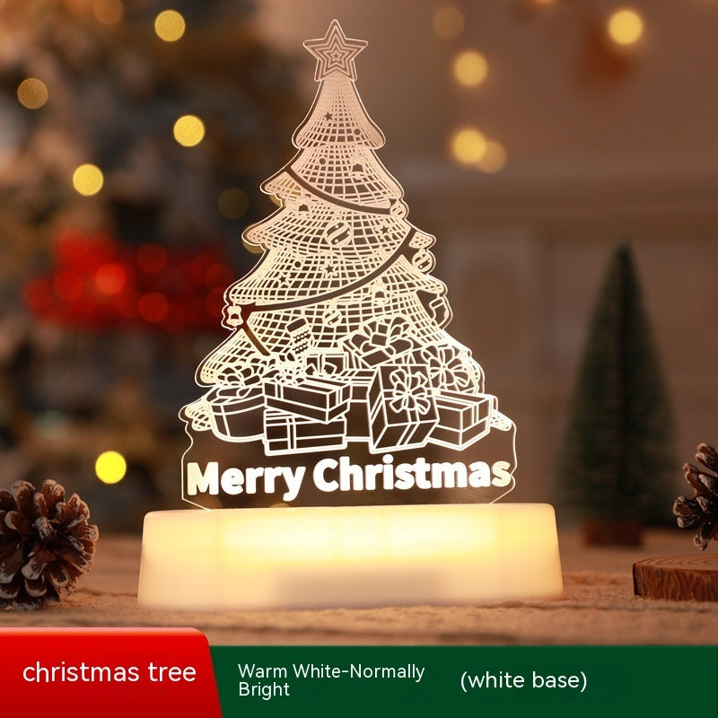 LED Christmas tree light with 'Merry Christmas' text on a white base, surrounded by festive decorations.